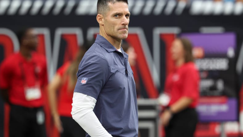 Nick Caserio on field before Texans game vs. Panthers.