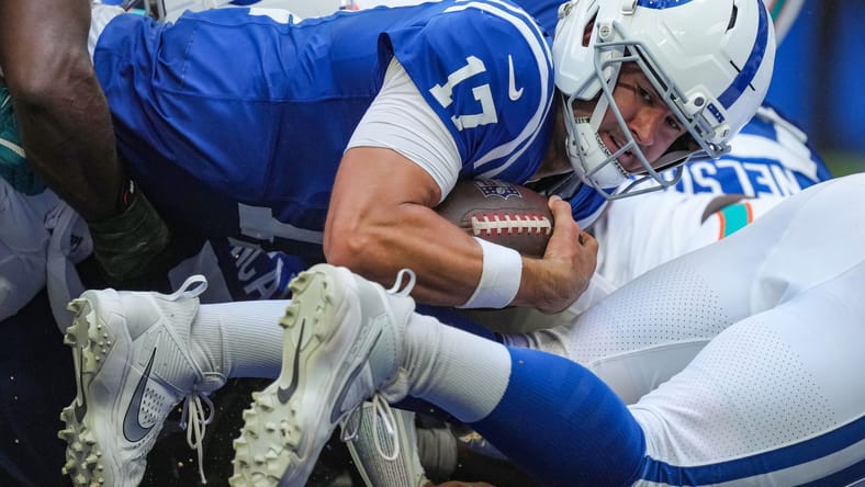 Daniel Jones scores on a quarterback sneak against the Dolphins in Indianapolis.