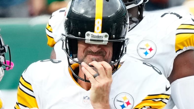 Aaron Rodgers gets up after sack during Steelers-Jets game at MetLife Stadium, 2025.