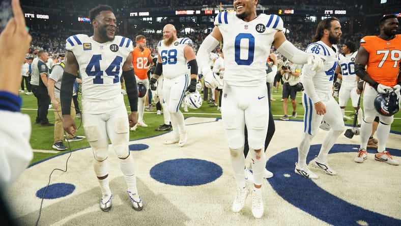 Cam Bynum and Zaire Franklin celebrate a Colts win over the Broncos at Lucas Oil Stadium.