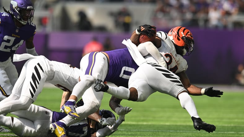Ivan Pace Jr. tackles Bengals running back Samaje Perine.
