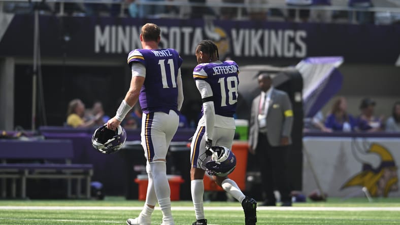 Carson Wentz and Justin Jefferson walk off field at halftime.