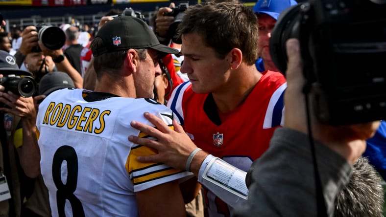 Aaron Rodgers and Drake Maye meet at midfield after Steelers-Patriots game.