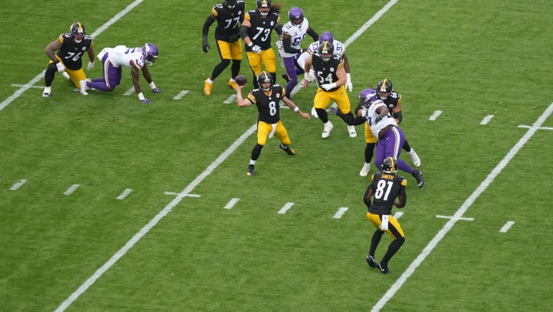 Aaron Rodgers throws deep pass during first half versus Vikings in Dublin.