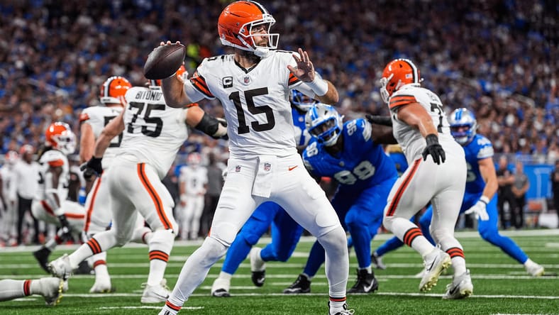 Joe Flacco throws pass against Lions at Ford Field. 