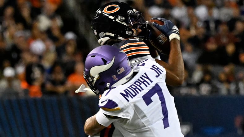Rome Odunze makes a catch against the Vikings during the first half at Soldier Field.