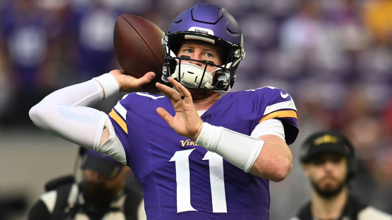 Carson Wentz warms up before the Vikings’ game against the Cincinnati Bengals at U.S. Bank Stadium.
