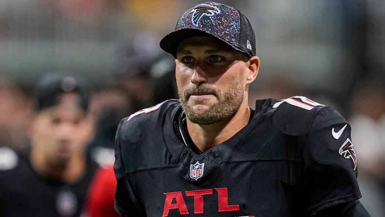 Kirk Cousins on field for Falcons during game against Commanders in Atlanta.