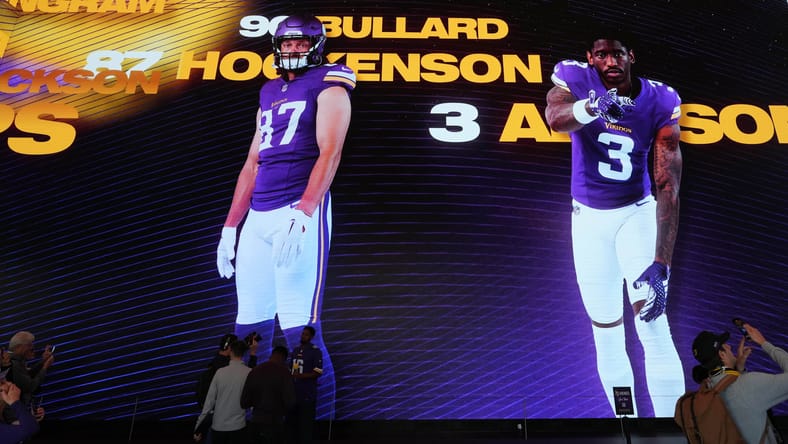 Images of Minnesota Vikings players T.J. Hockenson, Jordan Addison, and Ivan Pace Jr. projected on the walls during the team’s immersive experience at Outernet London before the 2024 International Series game against the New York Jets.
