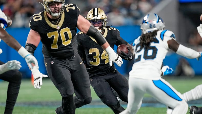 New Orleans Saints lineman Trevor Penning and running back Tony Jones in 2023.