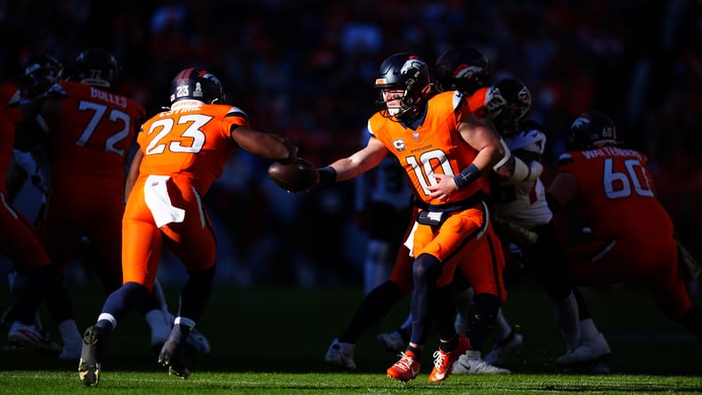 Bo Nix hands the ball to Audric Estime during the Broncos-Falcons game in Denver. Estime might look good on the Vikings PS.