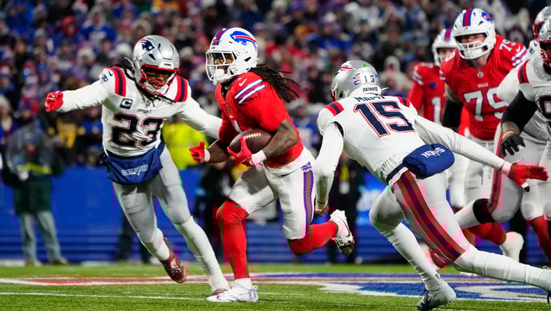 Patriots safety Kyle Dugger pursues Bills RB James Cook.