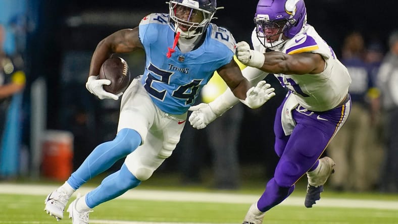 Kobe King makes a tackle on Jordan Mims during the Vikings’ preseason matchup against the Titans in Nashville.