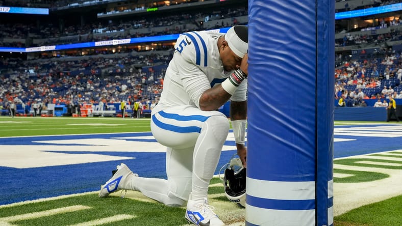 Anthony Richardson Sr. prays before the Colts’ game against the Broncos at Lucas Oil Stadium in Indianapolis.