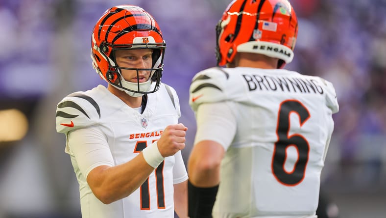Brett Rypien fist bumps Jake Browning before Bengals game vs. Vikings.