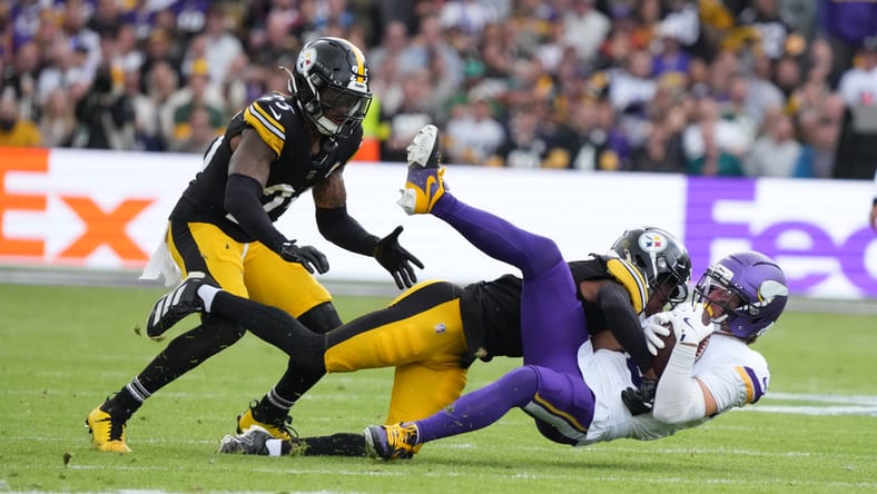 Adam Thielen is tackled by Steelers defenders during the Vikings’ International Series game in Dublin.