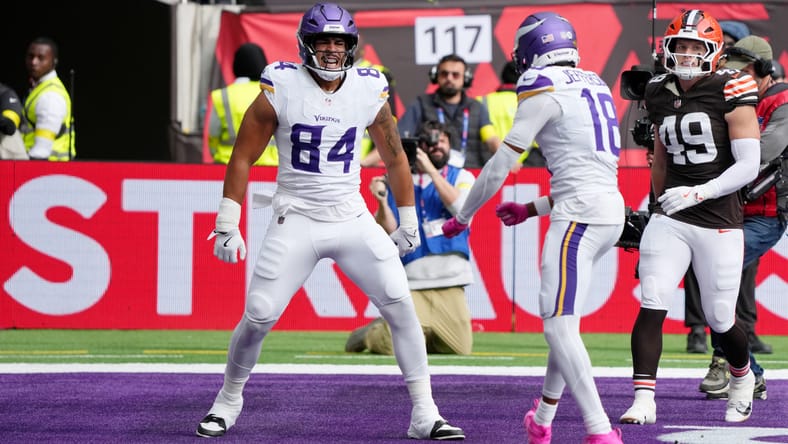 Josh Oliver celebrates a first-quarter touchdown for the Vikings against the Browns in London on Oct. 5, 2025.
