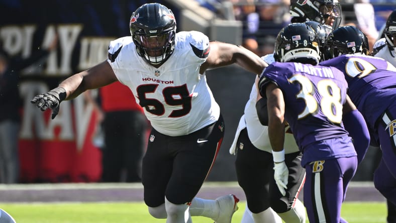 Ed Ingram blocks against Keyon Martin during the Texans-Ravens game at M&T Bank Stadium.