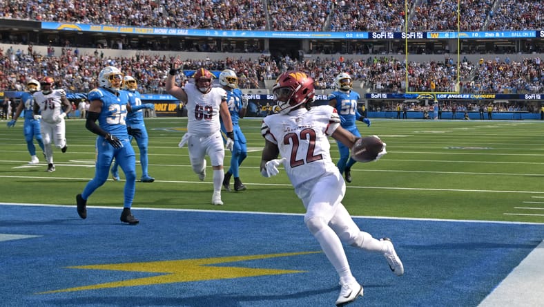 Jacory Croskey-Merritt celebrates a touchdown in the end zone during the Commanders’ game against the Chargers at SoFi Stadium.