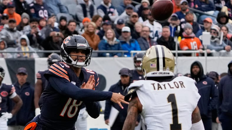 Caleb Williams throws under coverage from Alontae Taylor during the first half of the Bears’ game against the Saints at Soldier Field.