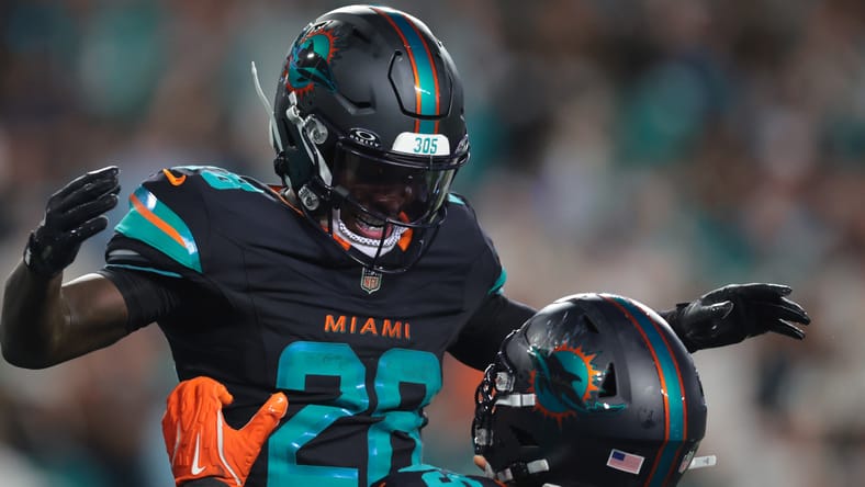 De’Von Achane celebrates after scoring a touchdown against the Jets during the second half at Hard Rock Stadium.