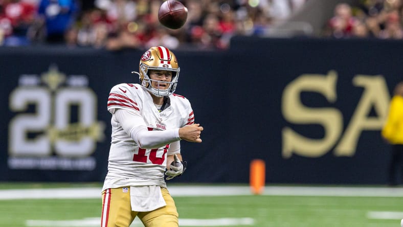 Mac Jones throws during second-half action against the Saints.
