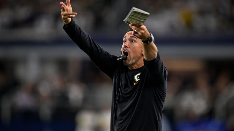 Packers head coach Matt LaFleur signals from the sideline during the game against the Cowboys at AT&T Stadium on September 28, 2025.