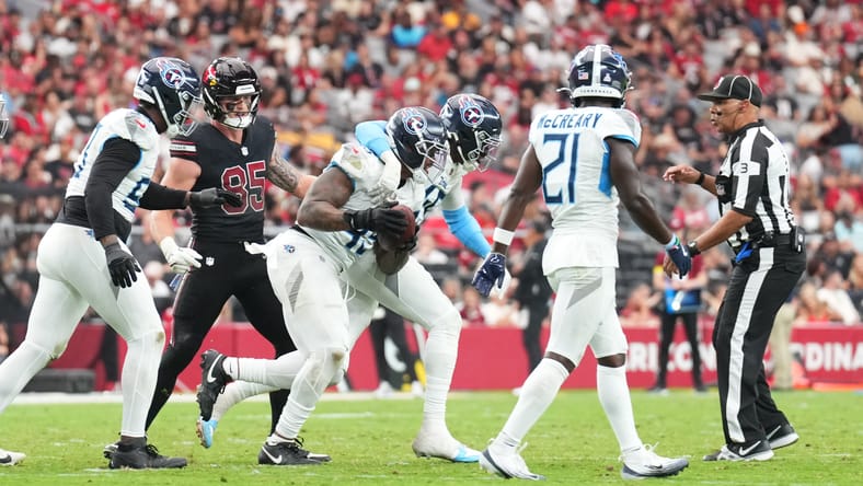 Tennessee Titans linebacker Dre’Mont Jones celebrates after recovering a fumble versus the Arizona Cardinals at State Farm Stadium.