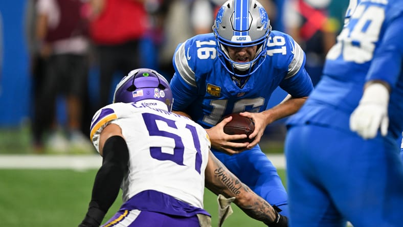 Blake Cashman sacks Jared Goff during the first quarter of the Vikings’ divisional matchup at Ford Field.