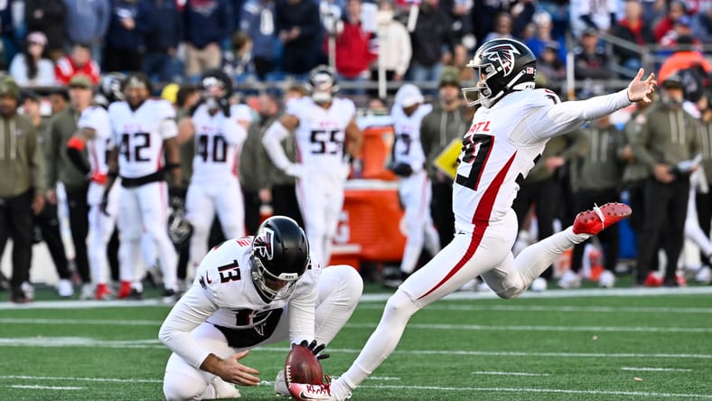 Former Vikings K Parker Romo kicks an extra point during first-half action against the Patriots at Gillette Stadium.