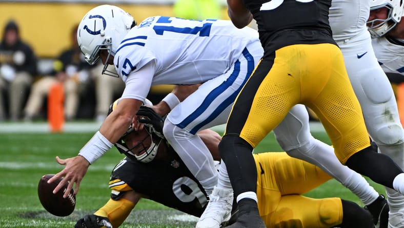 Daniel Jones and Chris Boswell dive for a loose ball during first-half action between the Colts and Steelers.