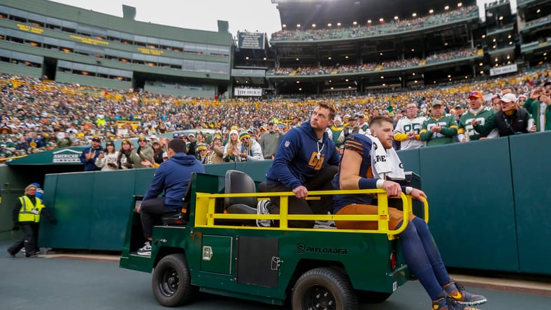 Tucker Kraft is carted off the field after sustaining a knee injury against the Panthers at Lambeau Field.