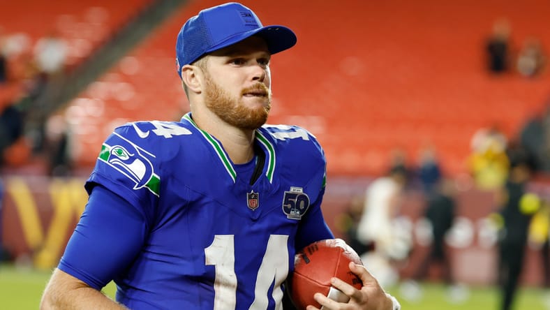 Former Vikings QB Sam Darnold leaves the field after a road win.