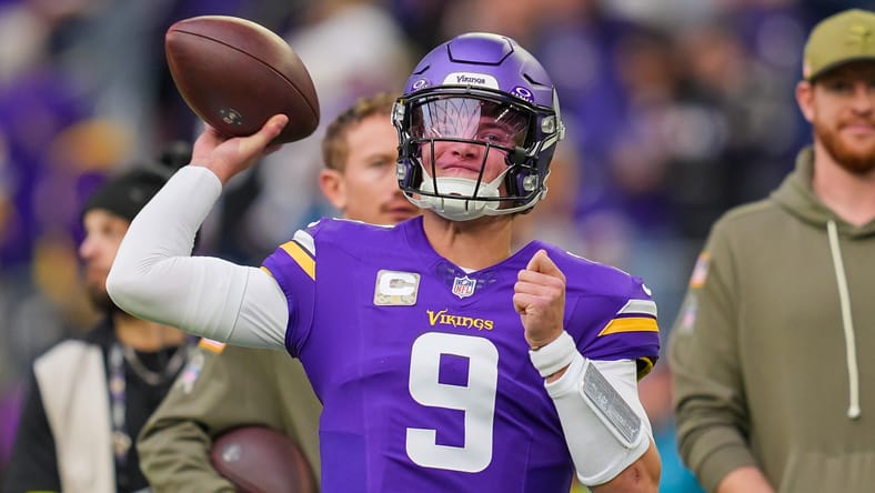 J.J. McCarthy warms up before facing the Baltimore Ravens at U.S. Bank Stadium on November 9, 2025.