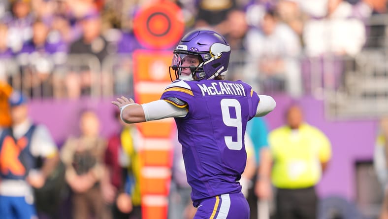J.J. McCarthy throws a deep pass against the Bears at U.S. Bank Stadium.