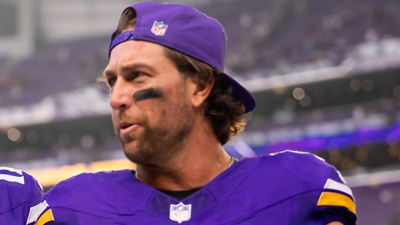 Max Brosmer and Adam Thielen leave the field after facing Cincinnati.