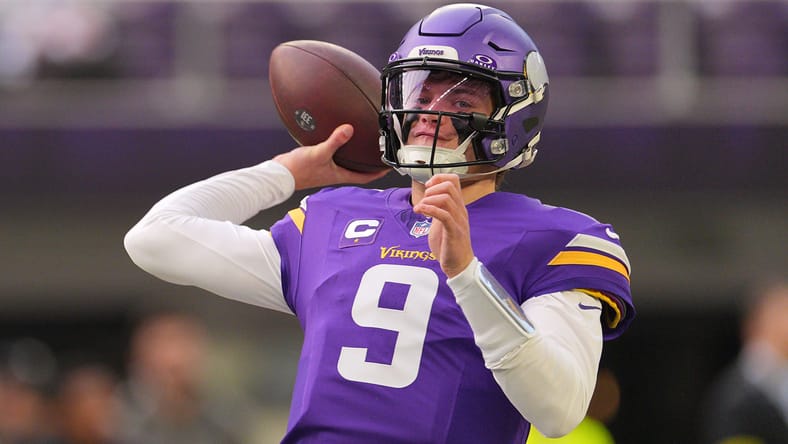 J.J. McCarthy warms up before the game at U.S. Bank Stadium.