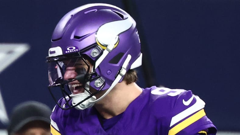 Jalen Nailor celebrates with J.J. McCarthy after a touchdown against the Cowboys at AT&T Stadium.