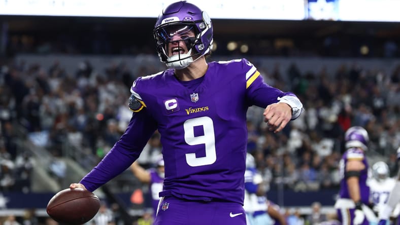 J.J. McCarthy celebrating a touchdown during a Vikings game against the Cowboys at AT&T Stadium