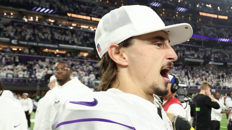 Vikings quarterback Max Brosmer and kicker Will Reichard interact on the field after a game at U.S. Bank Stadium.