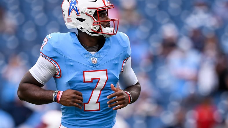 Malik Willis warms up for the Titans at Nissan Stadium.
