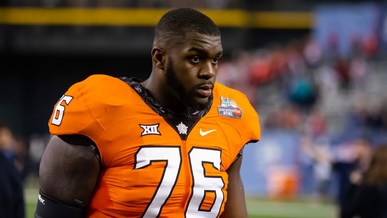 Caleb Etienne blocks during the Guaranteed Rate Bowl at Chase Field. Vikings sign Caleb Etienne