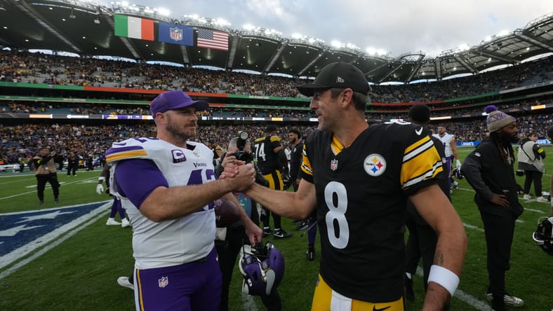 Andrew DePaola and Aaron Rodgers shake hands after the Dublin matchup.