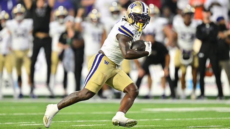 Jonah Coleman runs the ball against Maryland at SECU Stadium.