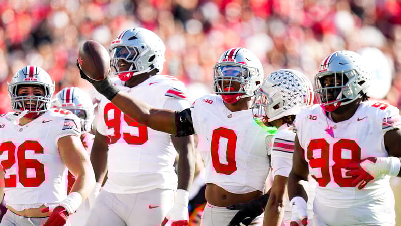 Sonny Styles celebrates after an interception against Wisconsin