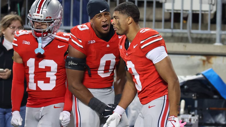 Lorenzo Styles Jr. celebrates a punt return touchdown with Sonny Styles at Ohio Stadium.