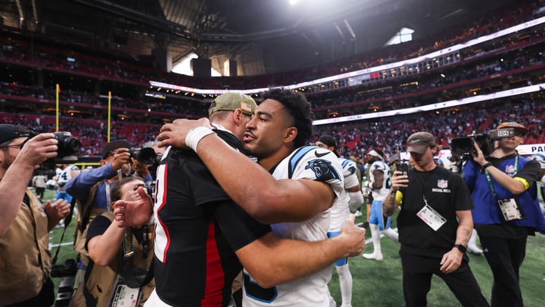 Kirk Cousins and Bryce Young in 2025 after the game.