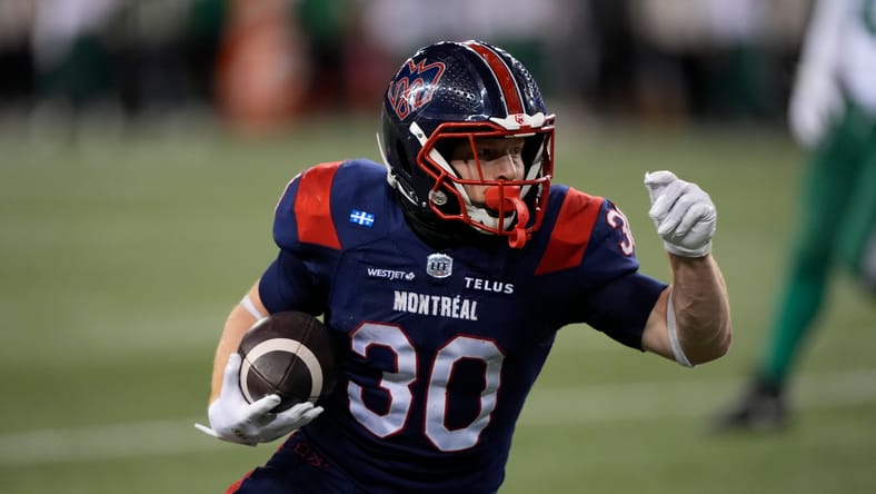 Travis Theis carries the ball during the Grey Cup in Winnipeg. Theis worked out for the VIkings on 12/9/25.