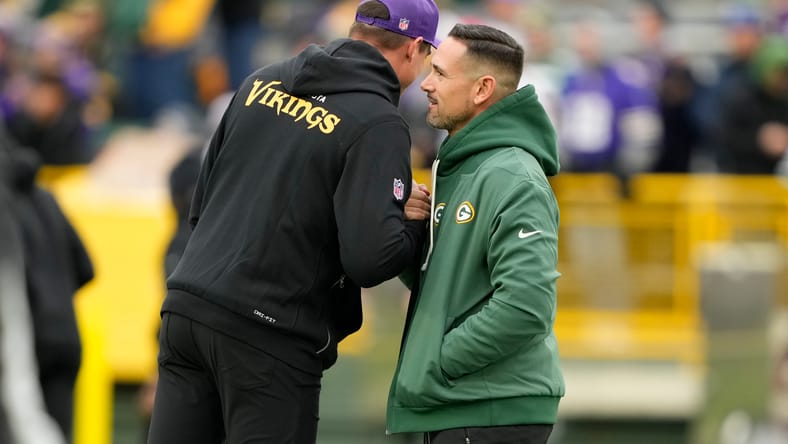 Kevin O’Connell and Matt LaFleur shake hands at midfield before a game.