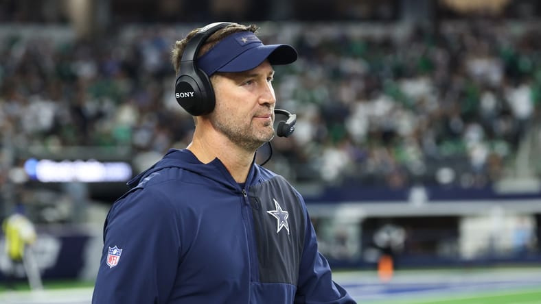 Brian Schottenheimer studies the field before facing Philadelphia.